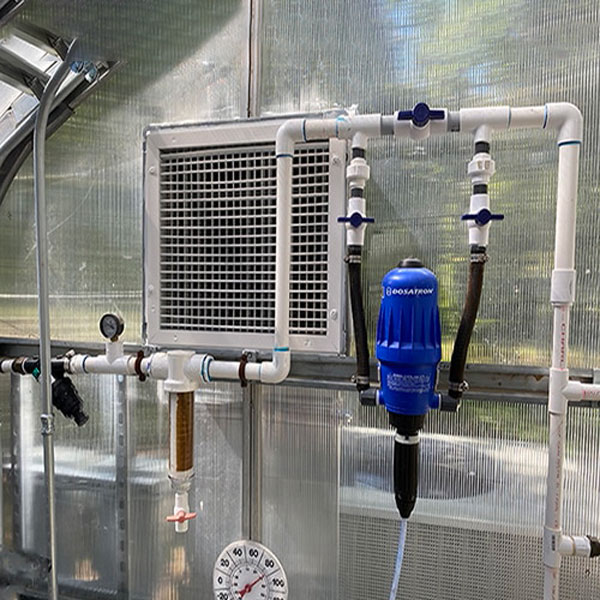 This is a typical Dosatron injector assembly in a greenhouse.